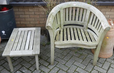 Lot 1364 - A contemporary slatted teak tub patio chair, w....