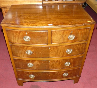 Lot 1317 - A reproduction mahogany bow front chest of two...