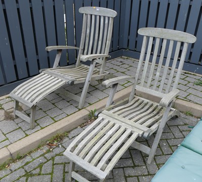 Lot 1370 - A pair of contemporary slatted teak extending...