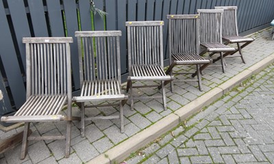Lot 1371 - A set of six contemporary slatted teak folding...