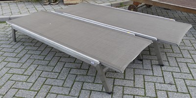 Lot 1374 - A pair of contemporary teak aluminium clad and...