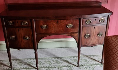 Lot 1326 - A 19th century mahogany bow front ledge back...