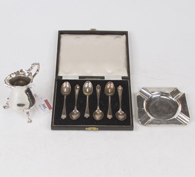 Lot 305 - An Edwardian silver cream jug, of helmet shape...
