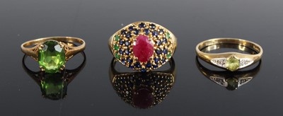 Lot 428 - A 9ct gold green peridot set dress ring, size...