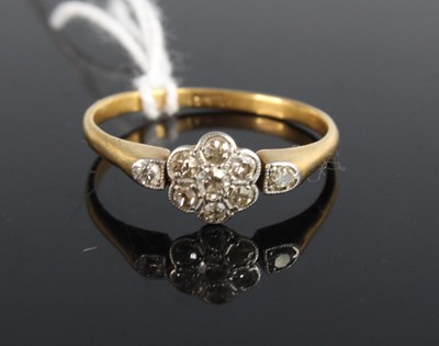 Lot 435 - An Art Deco 18ct gold diamond flower head...