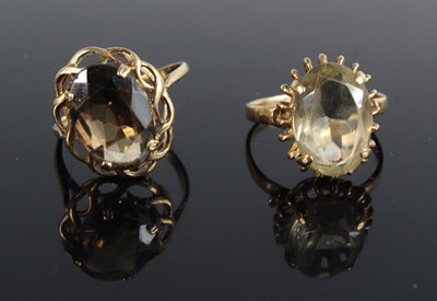 Lot 440 - A modern 9ct gold smoky quartz set dress ring,...
