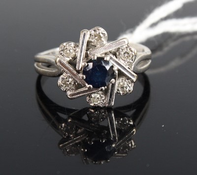 Lot 449 - A white metal, sapphire and diamond set flower...