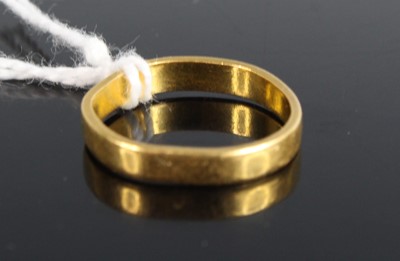 Lot 452 - A 22ct gold wedding band, 3.1g (misshapen)