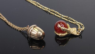 Lot 477 - A 9ct gold and polished hardstone claw and...