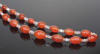 Lot 478 - A beaded amber glass and cut crystal necklace,...