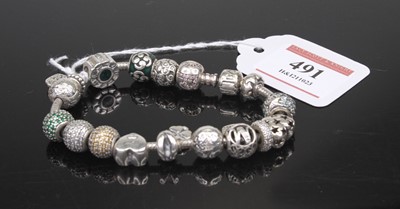 Lot 491 - A Pandora bracelet containing a good selection...