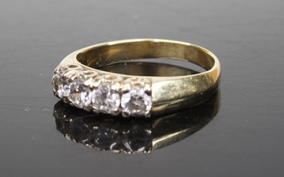 Lot 500 - A yellow metal and cz set four-stone half hoop...