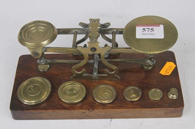 Lot 575 - A set of Victorian brass postage scales by...