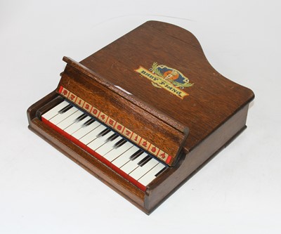 Lot 620 - A child's oak cased baby grand piano, (lacking...
