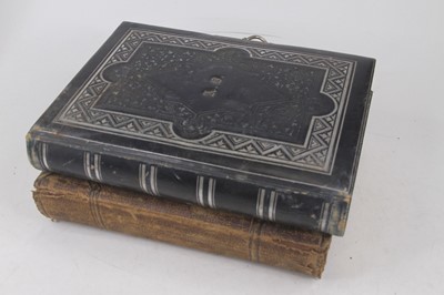Lot 598 - A Victorian embossed black leather photograph...