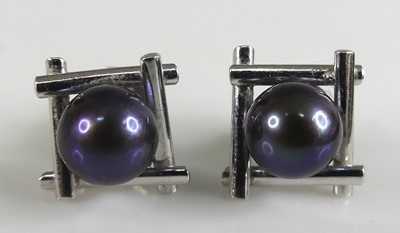 Lot 2616 - A pair of white metal pearl stud earrings,...