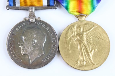 Lot 12 - A WW I British War and Victory pair, naming...