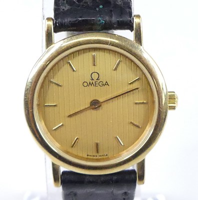 Lot 499 - A lady's Omega De Ville gold plated and steel...