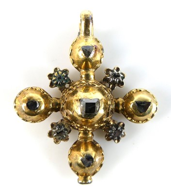 Lot 2802 - A yellow metal cross pendant set with nine...