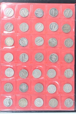 Lot 2044 - United States of America, a folder of coins to...