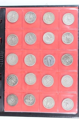 Lot 2044 - United States of America, a folder of coins to...