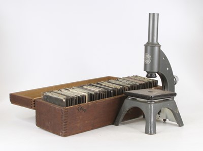 Lot 11 - A 20th century lacquered monocular microscope...