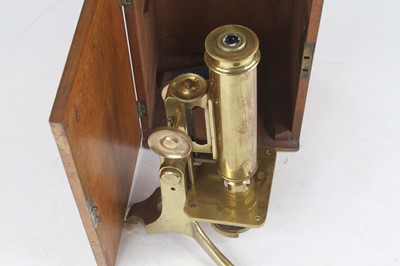 Lot 15 - A late 19th century lacquered brass monocular...
