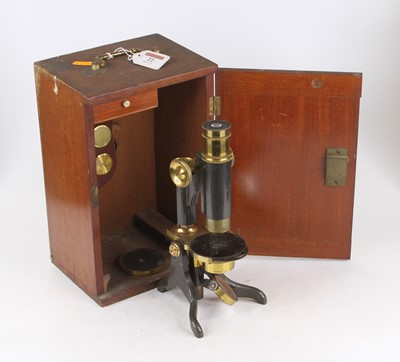 Lot 22 - An early 20th century lacquered brass and iron...