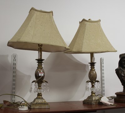 Lot 92 - A pair of polished hardstone and gilt painted...
