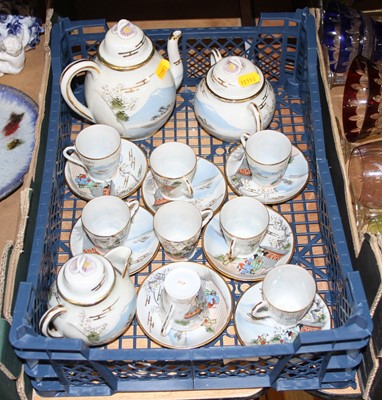 Lot 152 - A Japanese eggshell porcelain eight place...