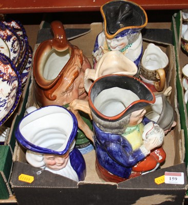 Lot 159 - A collection of toby jugs to include lidded...