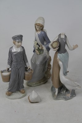 Lot 593 - A collection of three Lladro porcelain figures,...