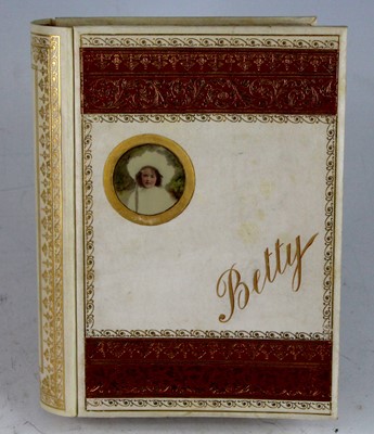 Lot 99 - An Edwardian photograph album, bound in gilt...