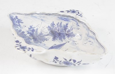 Lot 2029 - A Delft blue and white twin handled sauceboat,...