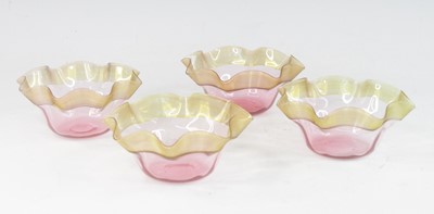 Lot 2054 - A set of four Stevens and Williams amber and...