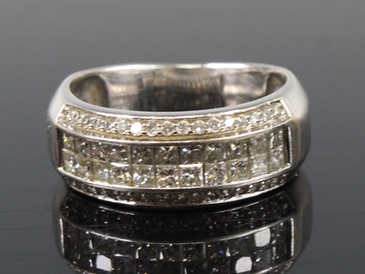 Lot 2680 - A white metal diamond four-row half eternity...