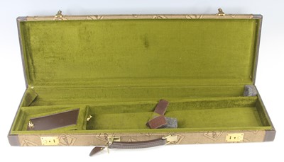 Lot 425 - A modern canvas clad and leather bound shotgun...