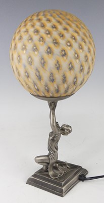 Lot 615 - An Art Deco style patinated and cast metal...