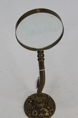 Lot 9 - An early 20th century brass adjustable desk...