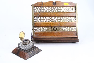 Lot 32 - An early 20th century oak and pierced brass...