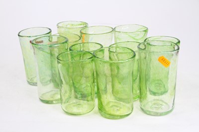 Lot 54 - A set of 12 green glass tumblers, each signed...