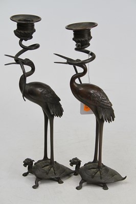Lot 51 - A pair of bronze table candelabra, each in the...