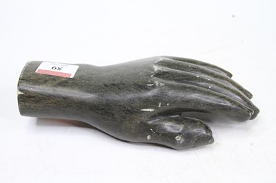 Lot 59 - A green polished shona hardstone model of a...