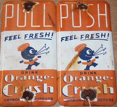 Lot 144 - A pair of enamel on metal Orange Crush...
