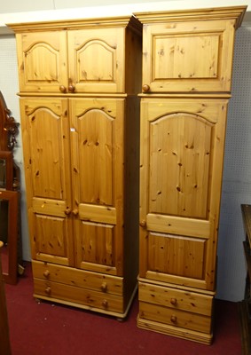 Lot 1161 - A modern pine double door wardrobe, having...