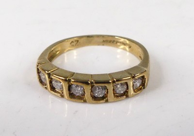 Lot 414 - A modern 9ct gold diamond half eternity ring,...