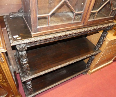 Lot 1265 - A circa 1900 ebonised and heavily relief...