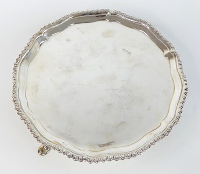 Lot 1150 - A George III silver card waiter, of shaped...