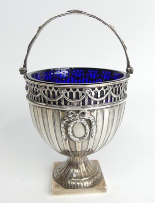Lot 1158 - A George III silver pedestal swing handled...