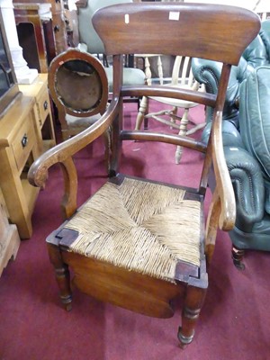 Lot 1336 - A Victorian mahogany bar back rush seat scroll...